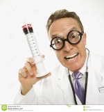 Doctor holding syringe 2046763 1
