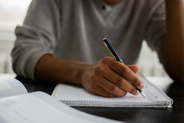 Black guy writing 1