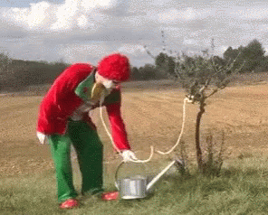 Clown watering the plant