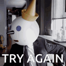 a snowman in a suit and tie with a cone on his head says try again4649742779298273515.gif